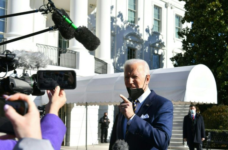 President Joe Biden said US democracy faces a 'defining' moment as he left the White House for Georgia