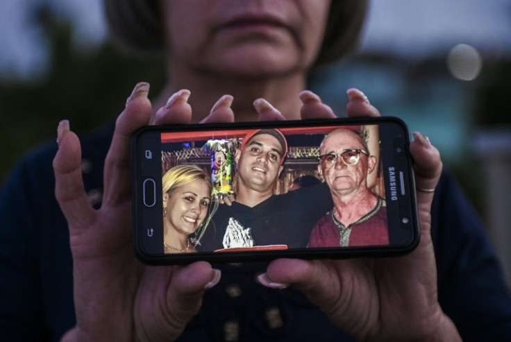 Zoila Rodriguez with a photo of her ex-husband Fredy Beirut and their children Exeynt and Katia, all three of whom are in prison for having participated in unprecedented anti-government protests Cuba in July 2021