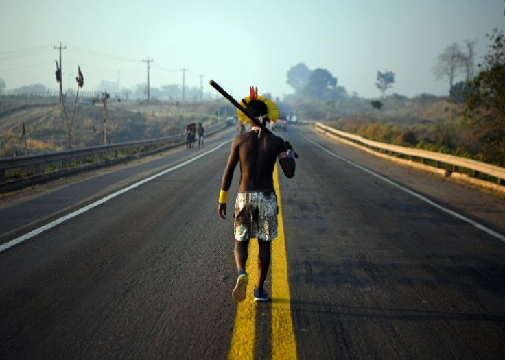 A member of the Kayapo tribe protests against illegal deforestation outside Novo Progresso in Para state, Brazil