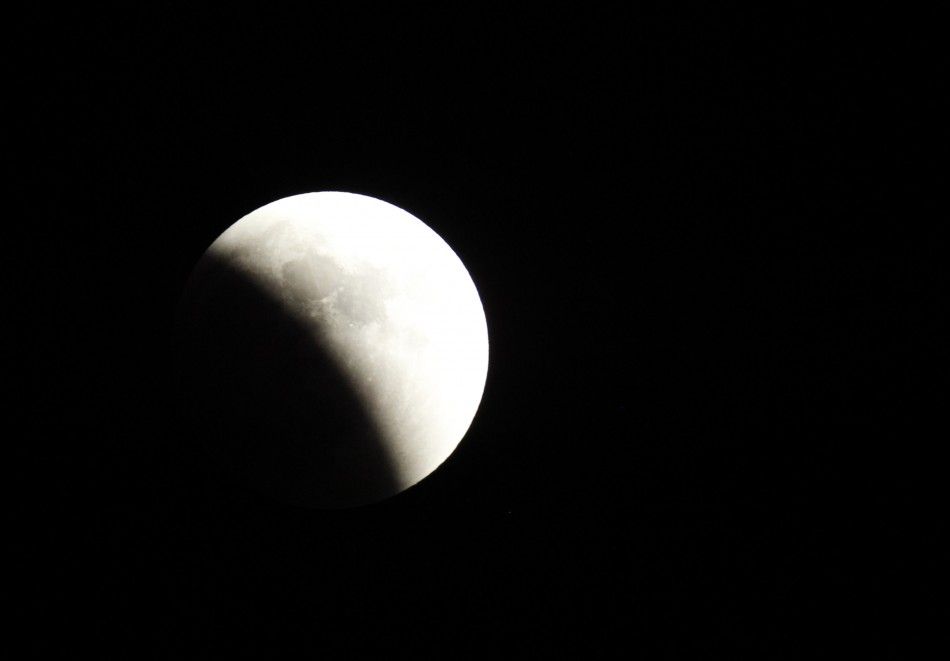 A shadow falls on the moon during a lunar eclipse, in Beirut