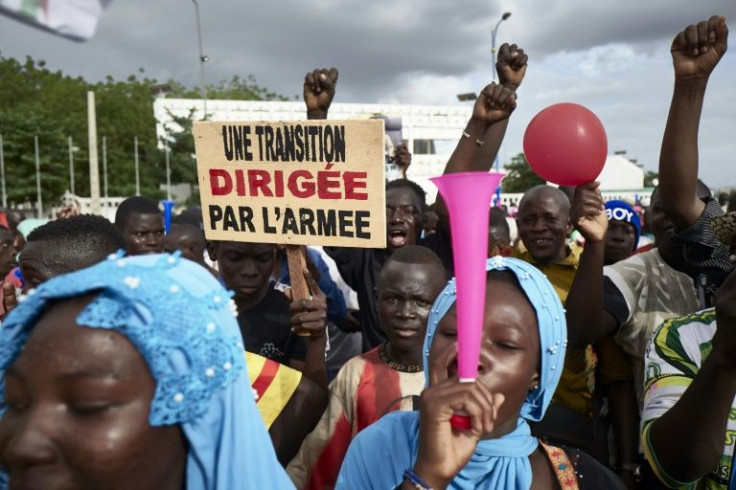 Malians rally in support of the junta several weeks after the 2020 coup. The sign reads: 'A transition led by the army'