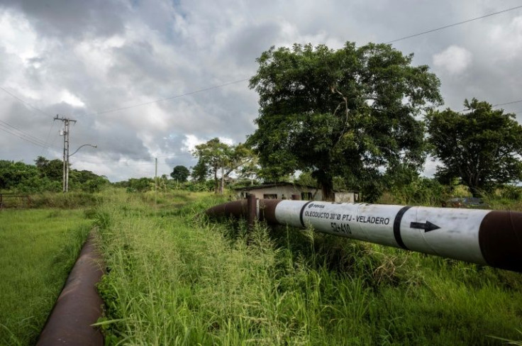 Cracked oil pipelines like this one cross through farms and private property in Venezuela's eastern oil zones