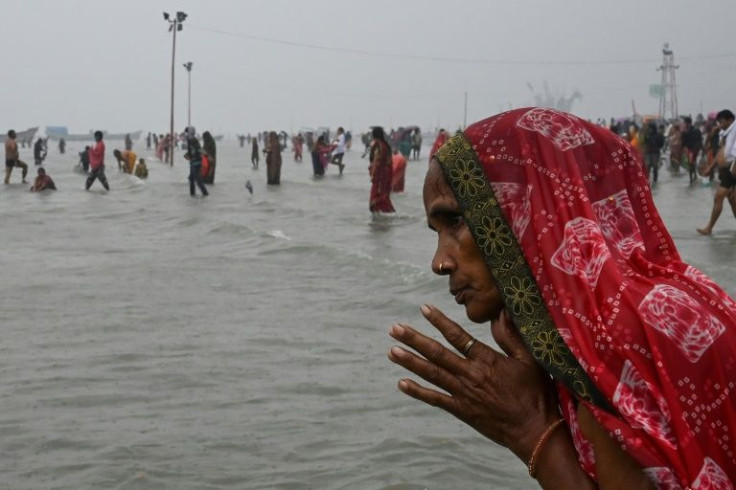 Huge crowds defied Covid rules to take a dip in the Ganges river at a Hindu festival in eastern India