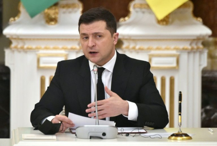 Ukrainian President Volodymyr Zelensky, seen speaking with his Azerbaijani counterpart Ilham Aliyev in Kyiv, has proposed a three-way crisis summit with the United States and Russia