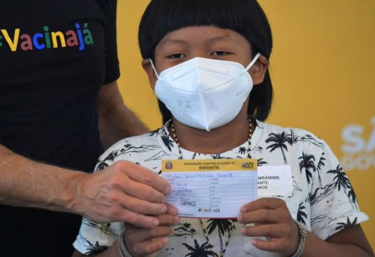 Eight-year-old Davi Seremramiwe Xavante was the first child aged five to 11 in Brazil to receive the Covid vaccine