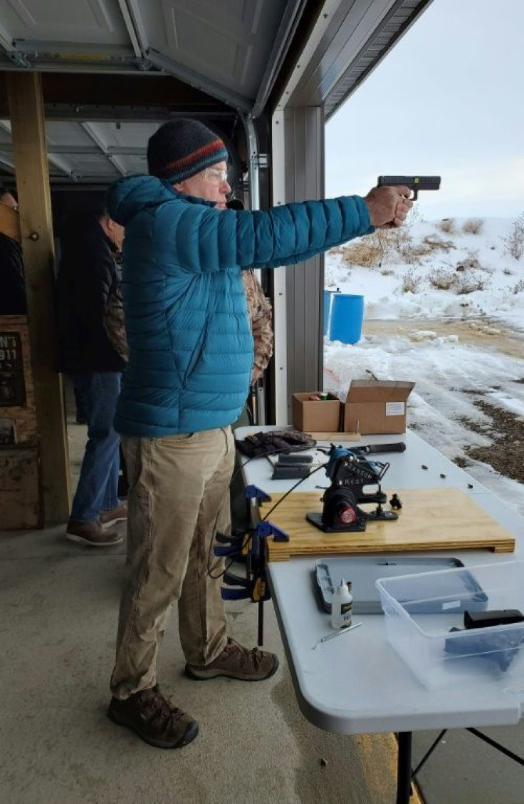 "Smart" pistols, like the one Ken Chandler  is test firing in this courtesy image, are designed to restrict who can fire them