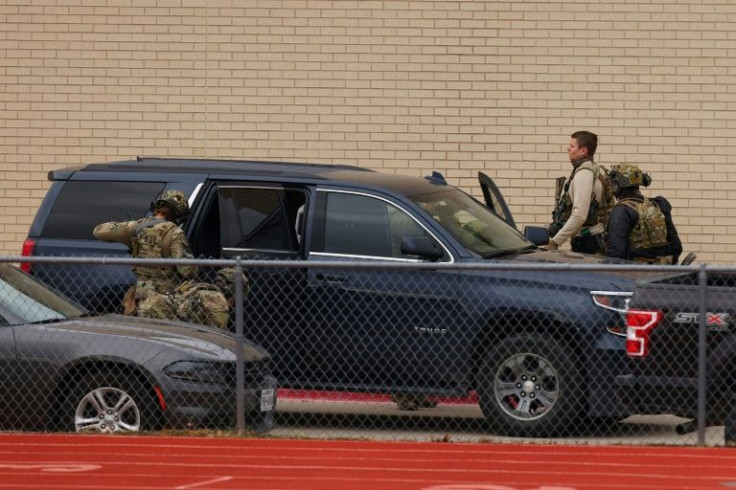 SWAT team members deploy near the synagogue