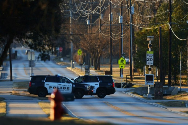 Police vehicles sit near Congregation Beth Israel Synagogue in Colleyville, Texas, some 25 miles (40 kilometers) west of Dallas, on January 16, 2022