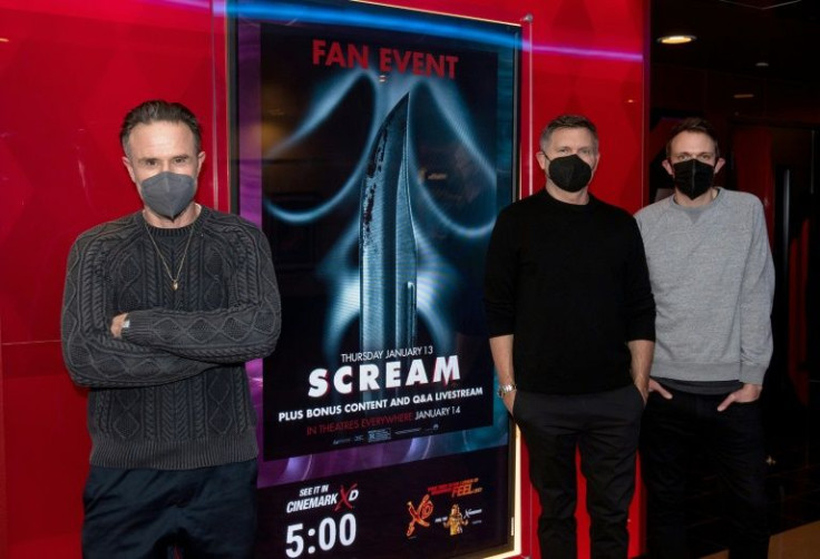 Actor David Arquette (L) is seen at a January 13, 2022 screening in Los Angeles of 'Scream,' along with director Matt Bettinelli-Olpin and screenwriter Kevin Williamson