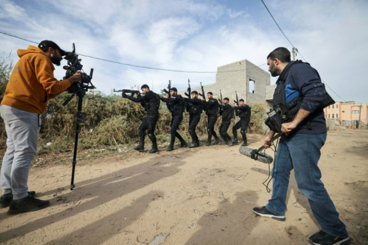 Palestinian crew shoot a scene of a series by local Al-Aqsa TV, 'Qabdat al-Ahrar', meaning 'Fist of the Free', in Gaza City