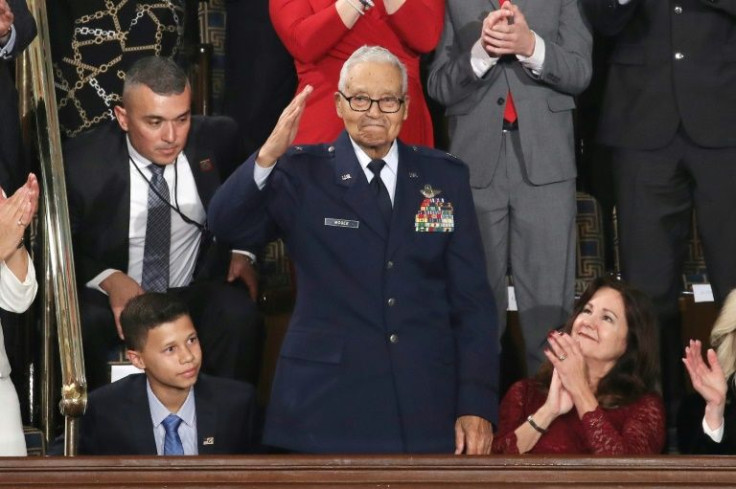 Retired US Air Force Colonel Charles McGee, who served with the Tuskegee Airmen and was later promoted to brigadier general, salutes during president Donald Trump's State of the Union address in 2020