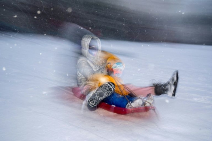 Children sled at Capitol Hill during a snowstorm in Washington