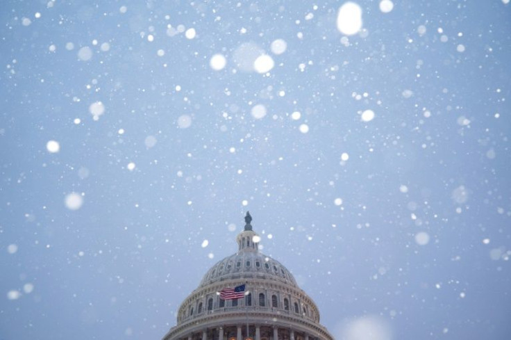 The US Capitol dome during a snowstorm in Washington, DC, on January 16, 2022