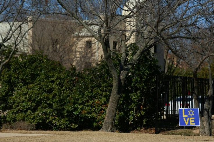 A sign is displayed outside of the Congregation Beth Israel Synagogue in Colleyville, Texas, some 25 miles (40 kilometers) west of Dallas, on January 16, 2022