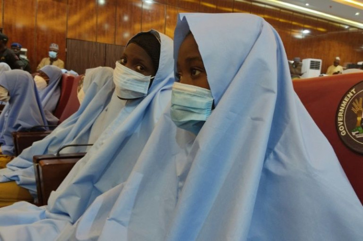 A group of girls who were kidnapped from their boarding school in northern Nigeria are seen in March 2021 at the Government House in Gusau, Zamfara State upon their release
