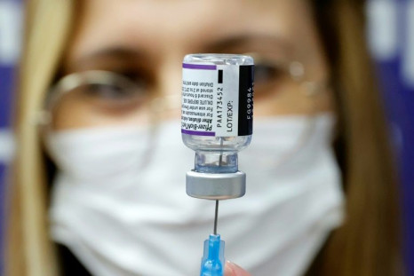 A medic prepares a dose of Pfizer vaccine to be used as a fourth shot at Sheba Medical Center in Ramat Gan, near Tel Aviv in December 2021