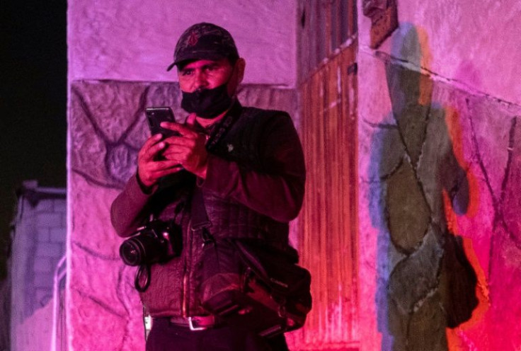 Photojournalist Margarito Martinez, seen here at a crime scene in November 2020, has been shot dead in the border city of Tijuana in northwest Mexico