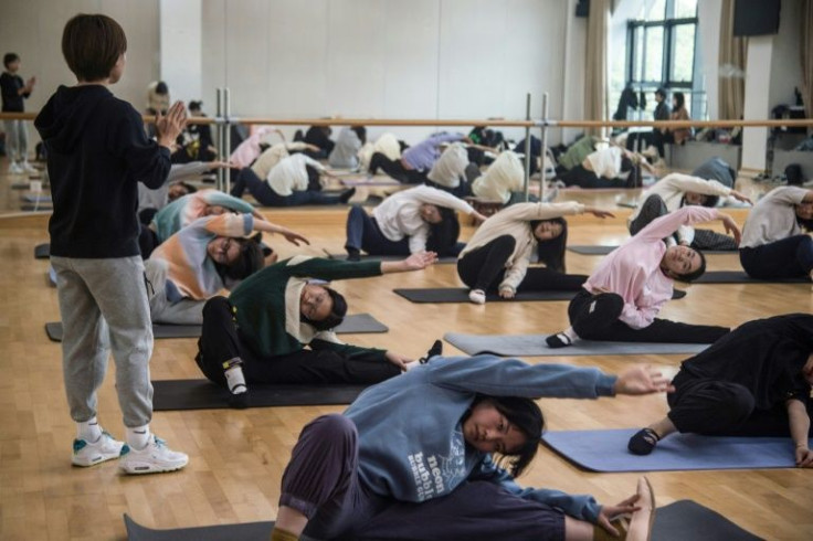 Former world champion gymnast Sui Lu teaches a basic fitness class at a Shanghai university