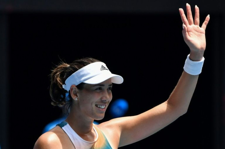 Third seed Garbine Muguruza celebrates her 6-3, 6-4 win over Clara Burel of France