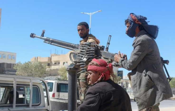 Yemeni pro-government fighters man a position in Ataq city, the capital of the province of Shabwa, east of the Red Sea port of Aden, on January 18, 2022