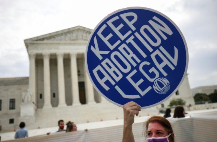 Jamie Manson voiced the frustrations she shares with pro-choice activists like this campaigner pictured in front of the Supreme Court in Washington on October 4, 2021