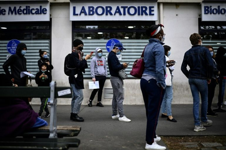 France reported 464,769 cases within 24 hours on Tuesday, a record number