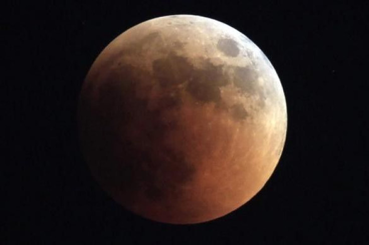 The moon is seen during a total lunar eclipse from Cairo June 15, 2011.