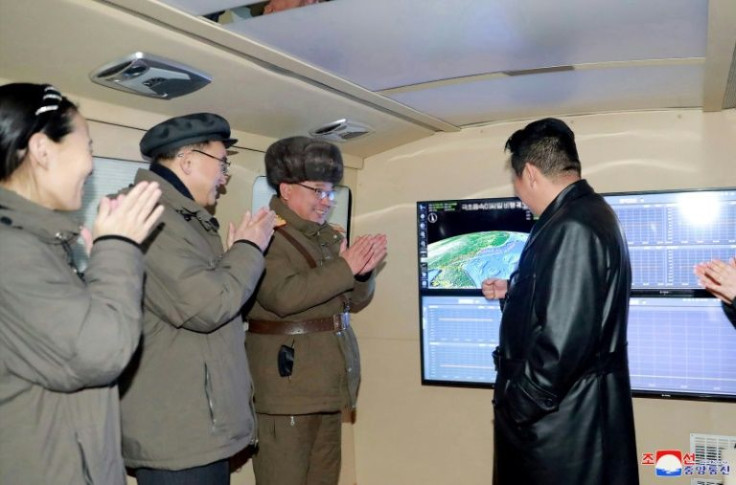 This photograph from North Korea's official Korean Central News Agency (KCNA) shows the country's leader Kim Jong Un speaking with military officials