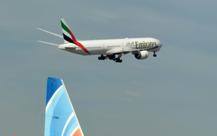 An Emirates Boeing 777-31H aircraft takes off from Dubai International Airport
