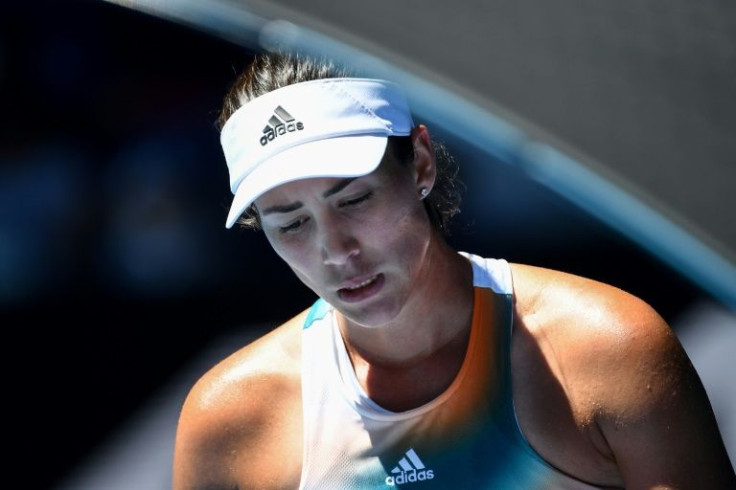 Third seed Garbine Muguruza suffered a shock second-round defeat to Alize Cornet