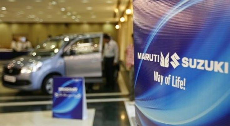 A customer stands inside a Maruti Suzuki's car showroom in the western Indian city of Ahmedabad April 26, 2010