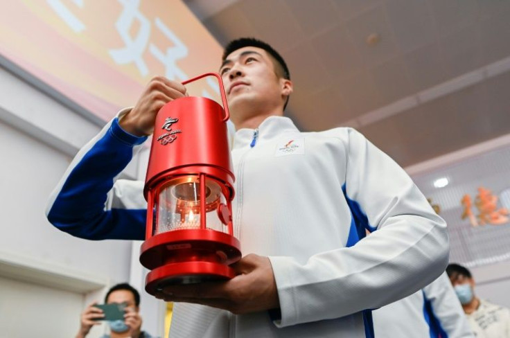 The flame of the Beijing Winter Olympics on tour at a university