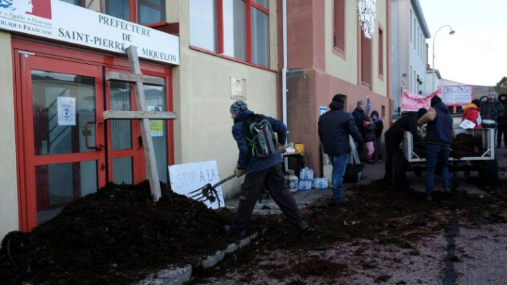 Protesters block a government building on the the French island of Saint-Pierre-et-Miquelon where a local lawmaker was pelted with seaweed in January