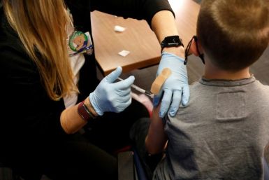 An eight-year-old child receives the Pfizer-BioNTech Covid-19 vaccine at the Beaumont Health offices in Southfield, Michigan on November 5, 2021