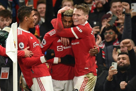 Manchester United's Marcus Rashford (C) celebrates his winner against West Ham