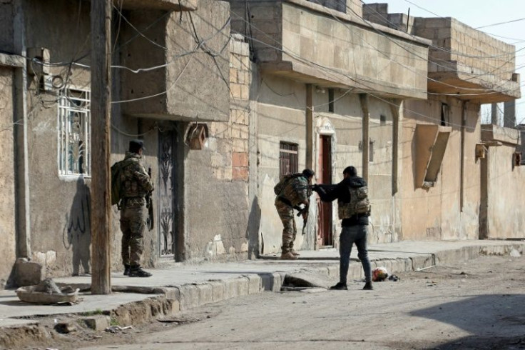Kurdish security forces deploy in Syria's northern city of Hasakeh on January 22 amid ongoing fighting with the Islamic State group following a prison attack