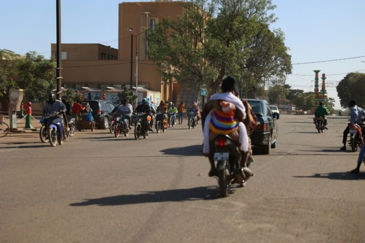 Commuters on Sunday in Ouagadougou, where gunfire was heard at several military barracks