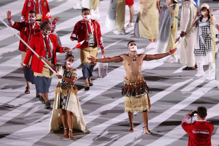 Flag bearers Malia Paseka and Pita Taufatofua of Team Tonga