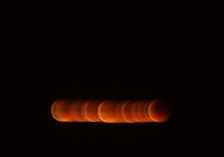 shadow falls on the moon as it undergoes a total lunar eclipse