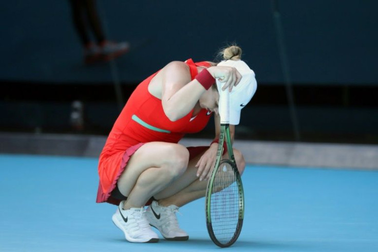 Distressed Simona Halep was suffering in the heat on Rod Laver Arena