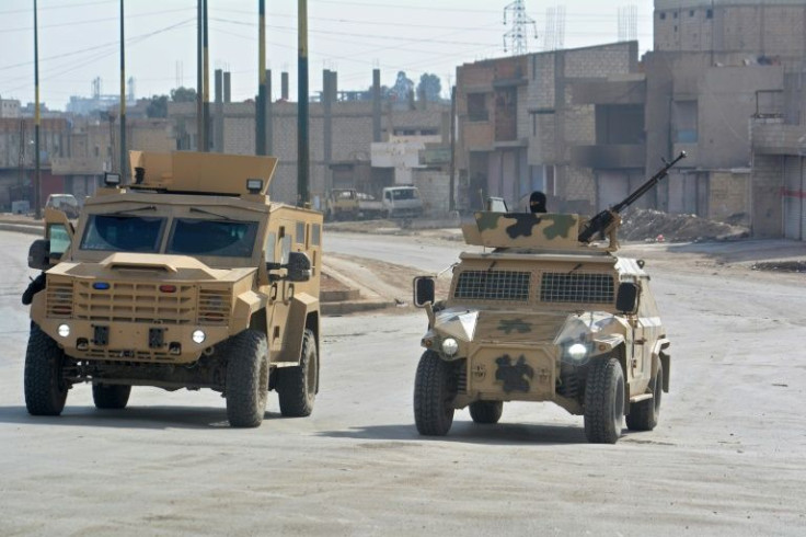 Syrian Democratic Forces (SDF) patrol a street in the northern Syrian city of Hasakeh on January 23