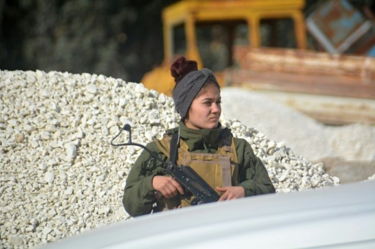 A member of the Kurdish Syrian Democratic Forces (SDF) mans a checkpoint in the northern Syrian city of Hasakeh on January 23