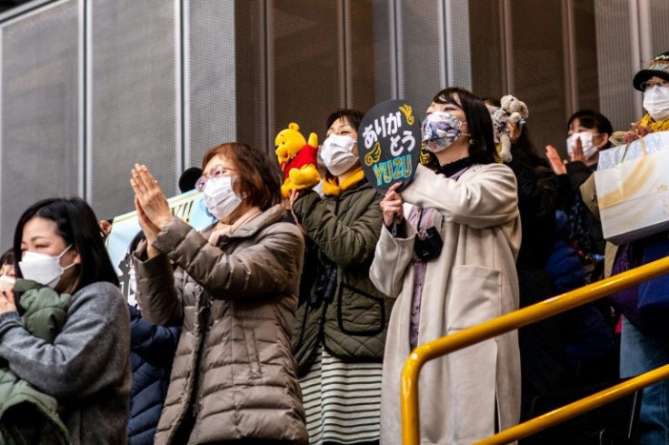 Fans take part in rituals like throwing Winnie the Pooh toys onto the ice after Hanyu performs