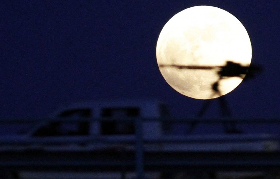 A heavy machine gun on a rebel fighter039s vehicle is pictured against the moon during a total lunar eclipse in Benghazi