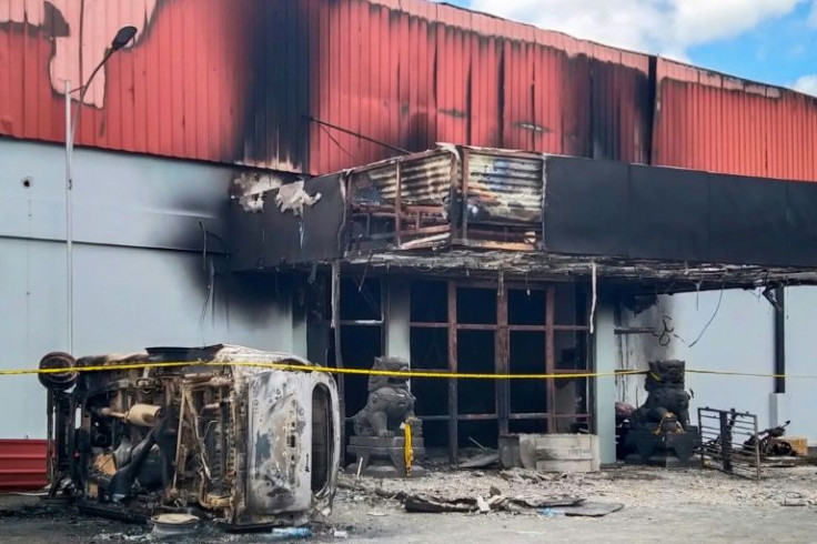 Indonesian police said 17 bodies were found in the Double O club in Sorong which caught fire during clashes between two groups while another person was stabbed to death