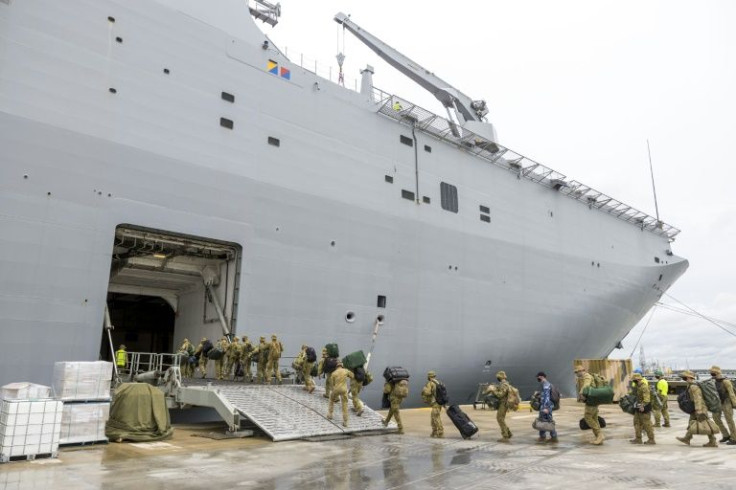 Members of the Australian Defence Force board the HMAS Adelaide in Brisbane earlier this month, before setting sail for Tonga.