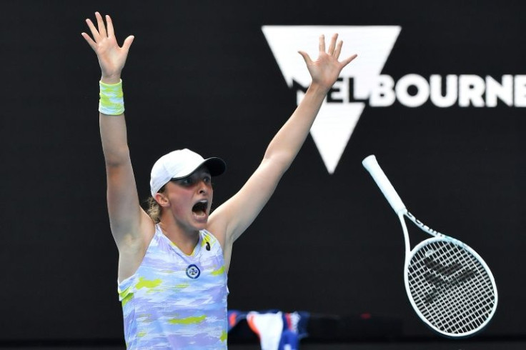 Iga Swiatek celebrates beating Kaia Kanepi to reach the Australian Open semi-finals