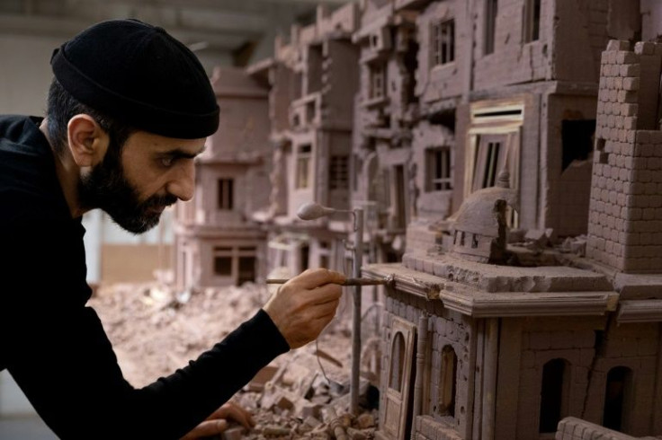 Artist Khaled Dawwa, a Syrian exile and prison survivor, now works in France