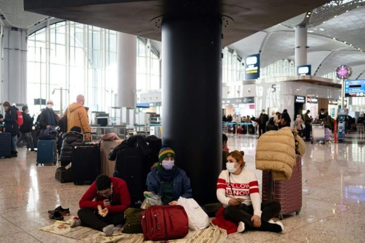 Stranded passengers complained of poor customer service, some joining a chant demanding 'we need a hotel'