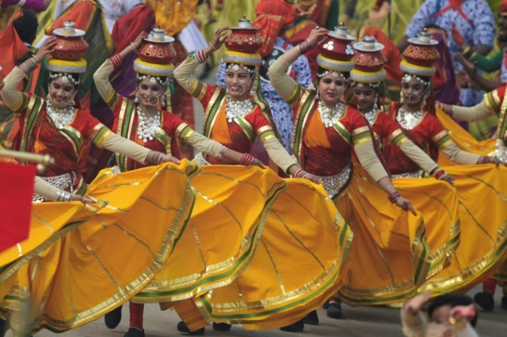 The ceremony in New Delhi featured mobile parade floats highlighting India's history and cultural diversity alongside traditional dancers